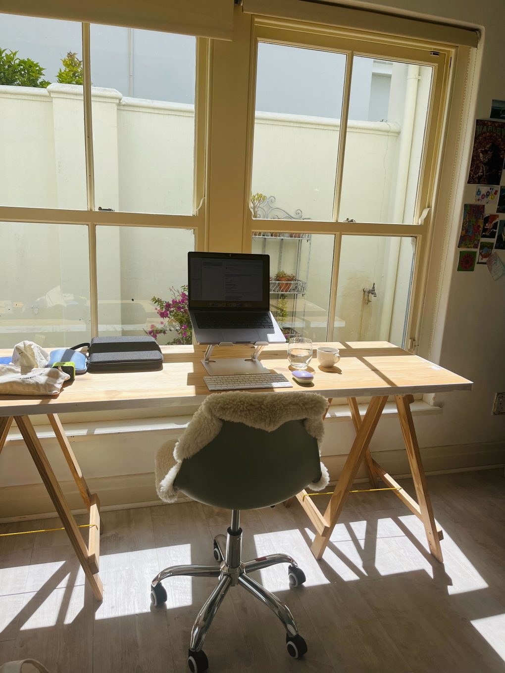 Workplace at the wooden table in front of the window 